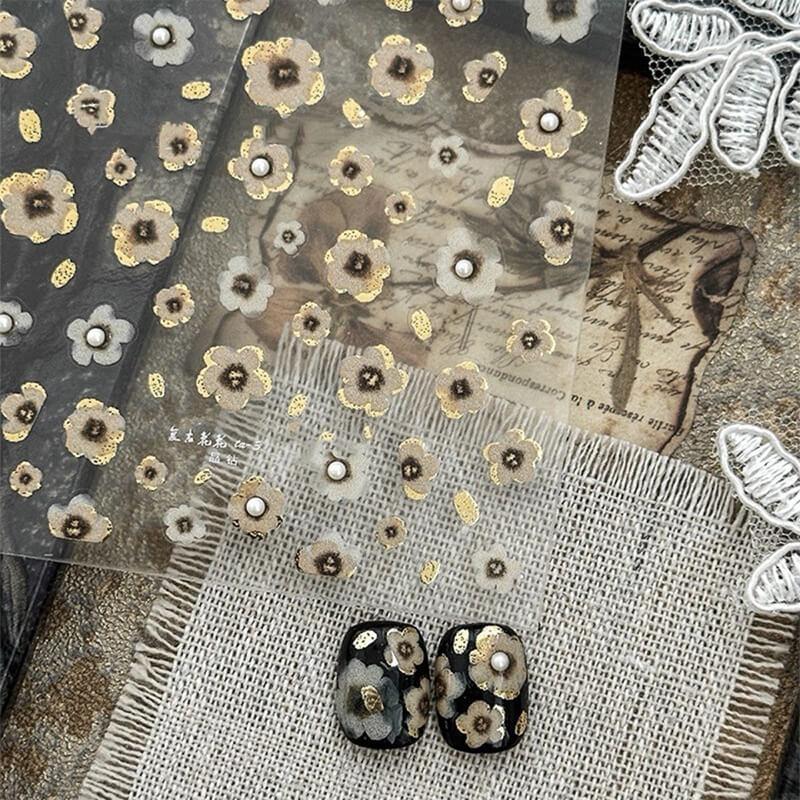 Vintage black and gold embossed 3D flower nail stickers with irregular blooming design